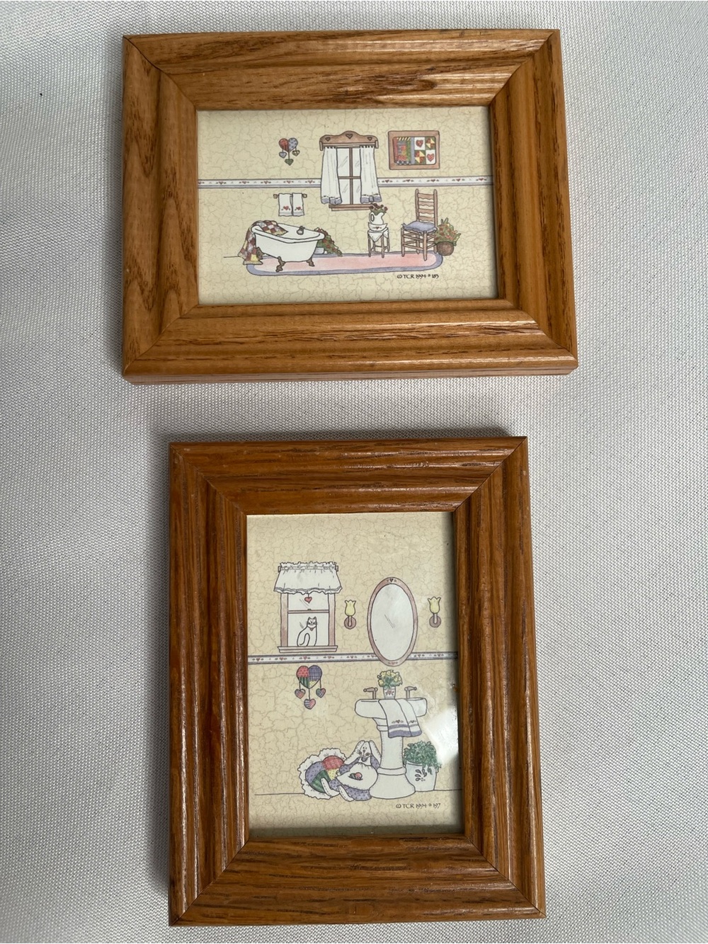 2 Vintage framed bathroom prints with cartoon illustration of bathroom scenes